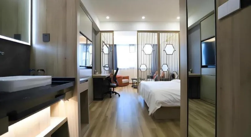 Bed in VX Hotel Jiangsu Taizhou Xinghua RT-Mart