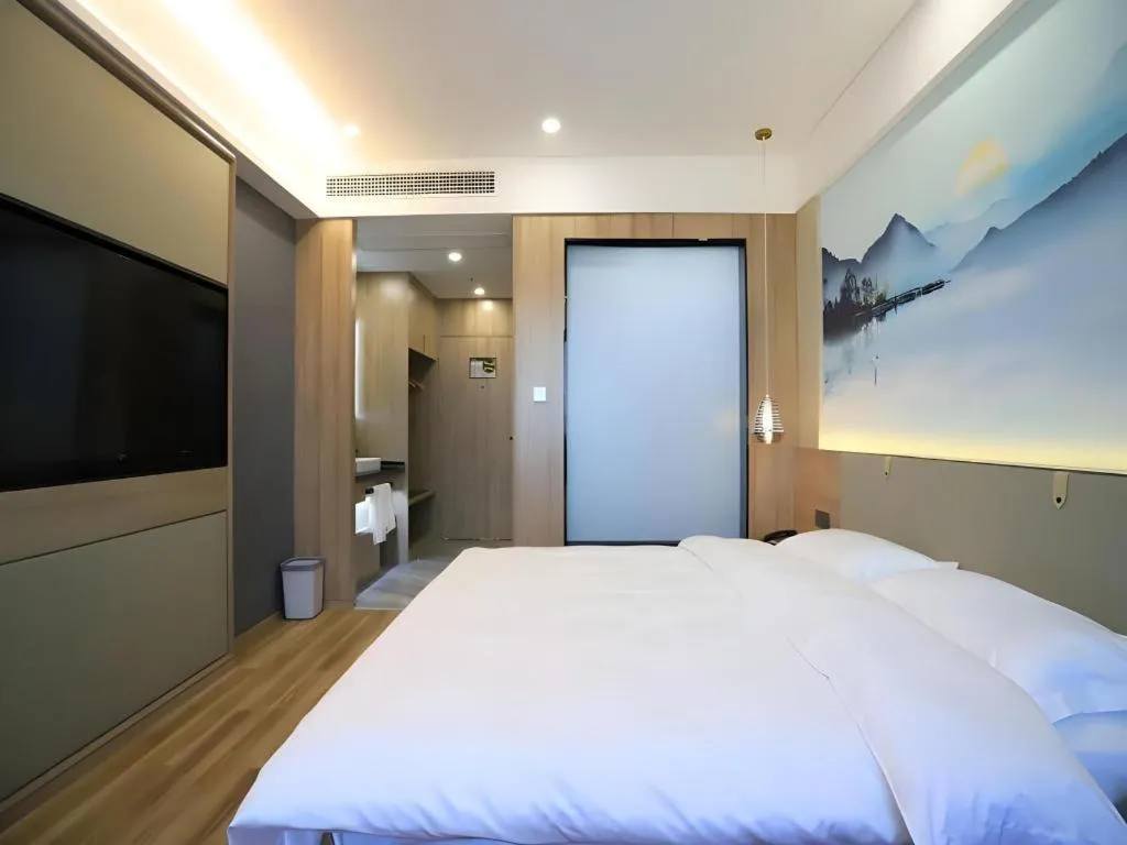 Bed in VX Hotel Jiangsu Taizhou Xinghua RT-Mart