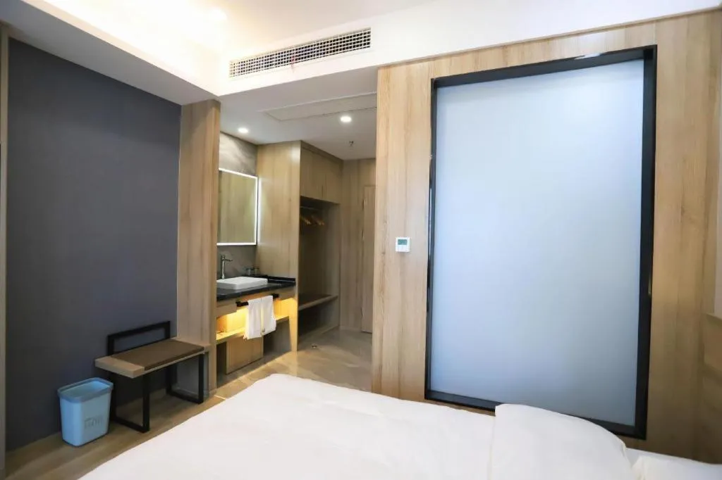 Bed in VX Hotel Jiangsu Taizhou Xinghua RT-Mart