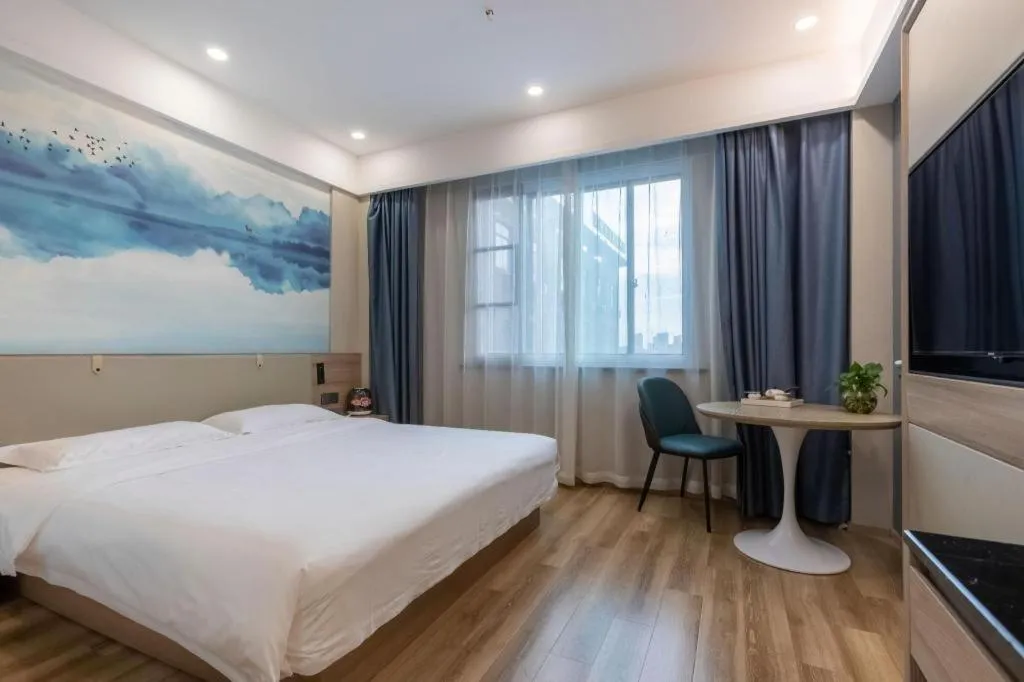 Bed in VX Hotel Jiangsu Taizhou Xinghua RT-Mart