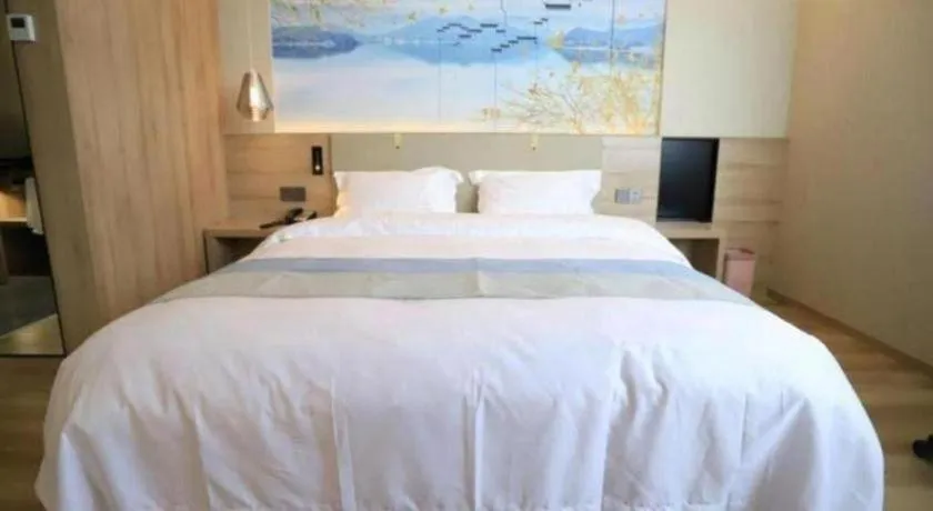 Bed in VX Hotel Jiangsu Taizhou Xinghua RT-Mart