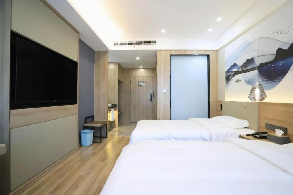 Bed in VX Hotel Jiangsu Taizhou Xinghua RT-Mart