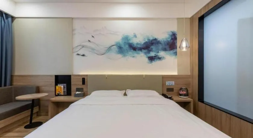 Bed in VX Hotel Jiangsu Taizhou Xinghua RT-Mart