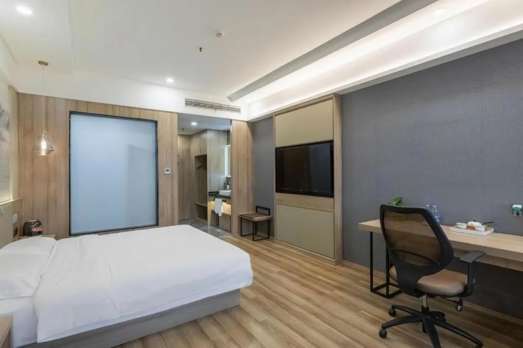 Bed in VX Hotel Jiangsu Taizhou Xinghua RT-Mart