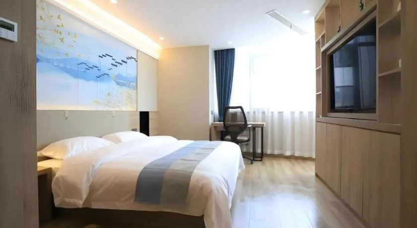 Bed in VX Hotel Jiangsu Taizhou Xinghua RT-Mart