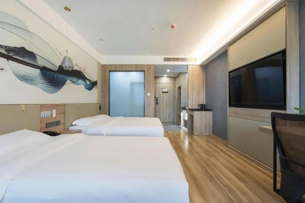 Bed in VX Hotel Jiangsu Taizhou Xinghua RT-Mart