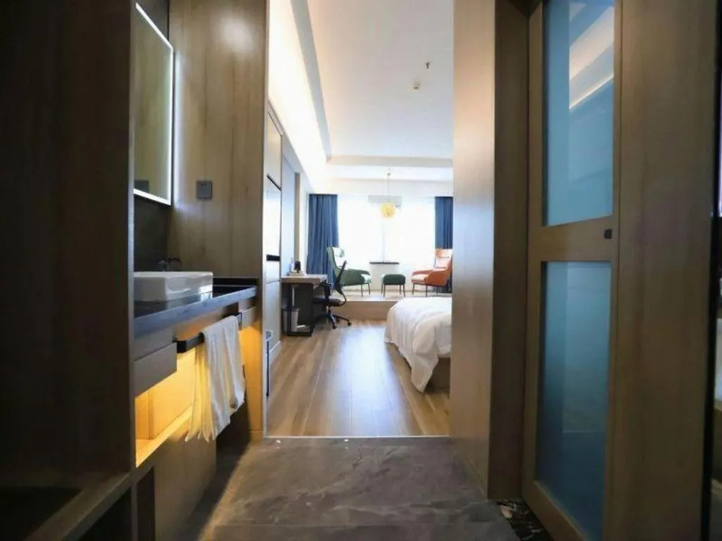 Bed in VX Hotel Jiangsu Taizhou Xinghua RT-Mart