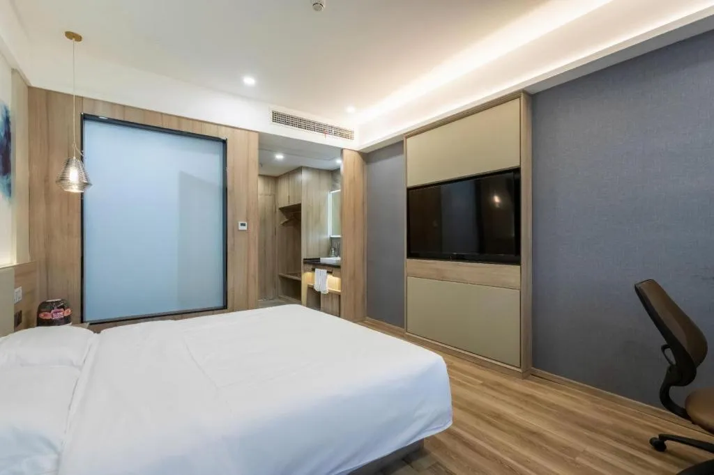 Bed in VX Hotel Jiangsu Taizhou Xinghua RT-Mart