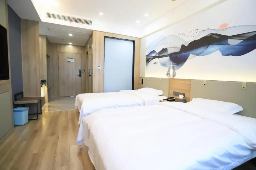 Bed in VX Hotel Jiangsu Taizhou Xinghua RT-Mart