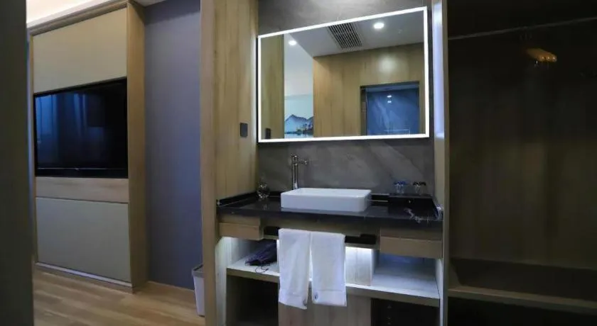 Bed in VX Hotel Jiangsu Taizhou Xinghua RT-Mart