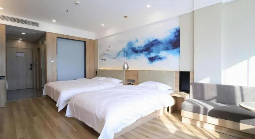 Bed in VX Hotel Jiangsu Taizhou Xinghua RT-Mart