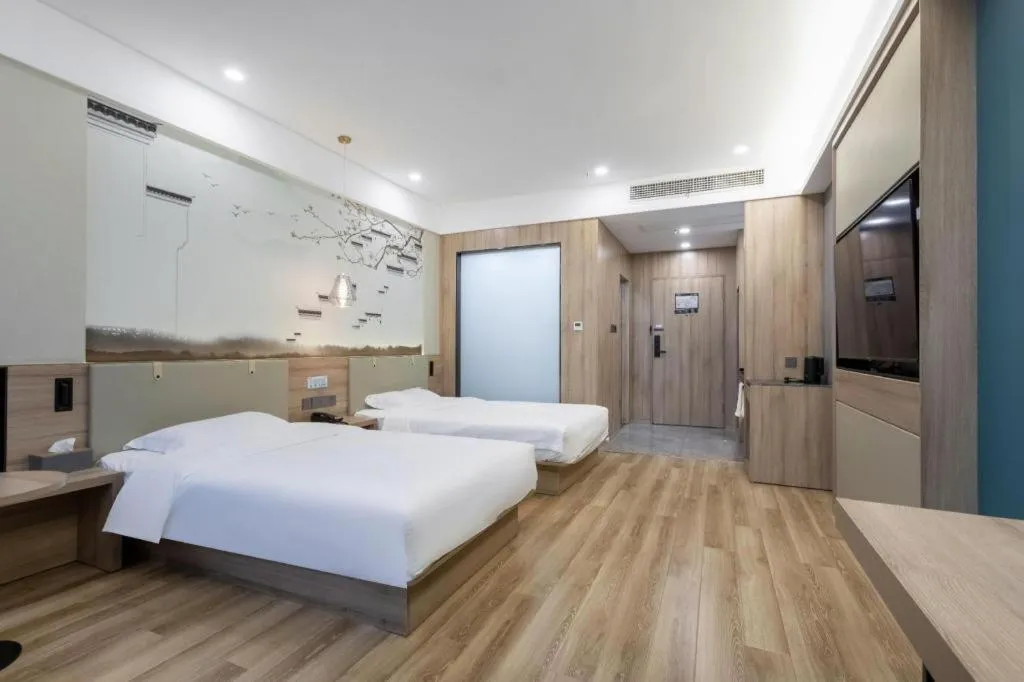 Bed in VX Hotel Jiangsu Taizhou Xinghua RT-Mart