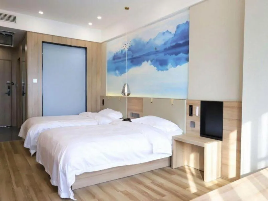 Bed in VX Hotel Jiangsu Taizhou Xinghua RT-Mart