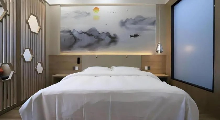 Bed in VX Hotel Jiangsu Taizhou Xinghua RT-Mart