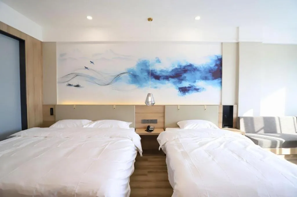 Bed in VX Hotel Jiangsu Taizhou Xinghua RT-Mart