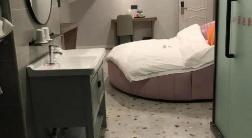 Bed in Shell Hotel Shanghai Jinshan Wanda Plaza