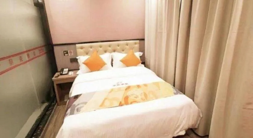 Bed in Shell Hotel Shanghai Jinshan Wanda Plaza