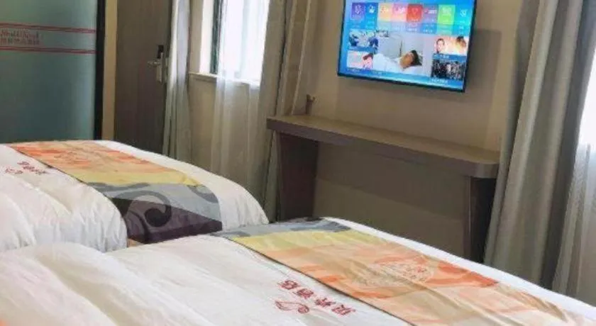 Bed in Shell Hotel Shanghai Jinshan Wanda Plaza