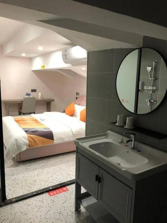 Bed in Shell Hotel Shanghai Jinshan Wanda Plaza