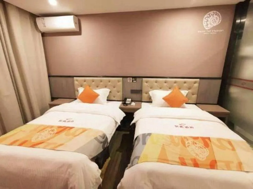 Bed in Shell Hotel Shanghai Jinshan Wanda Plaza