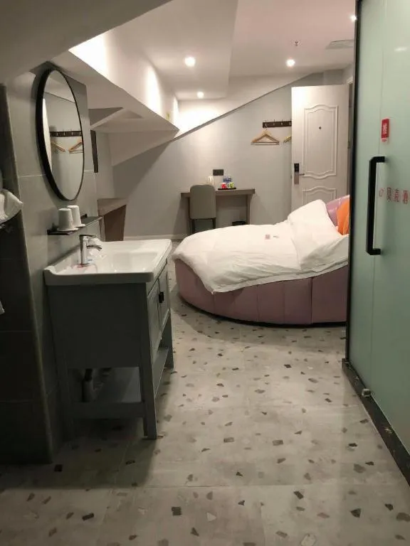 Bed in Shell Hotel Shanghai Jinshan Wanda Plaza