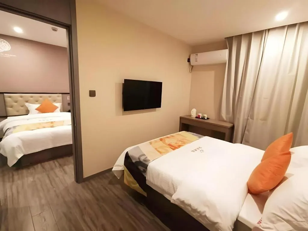 Bed in Shell Hotel Shanghai Jinshan Wanda Plaza