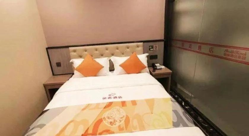 Bed in Shell Hotel Shanghai Jinshan Wanda Plaza