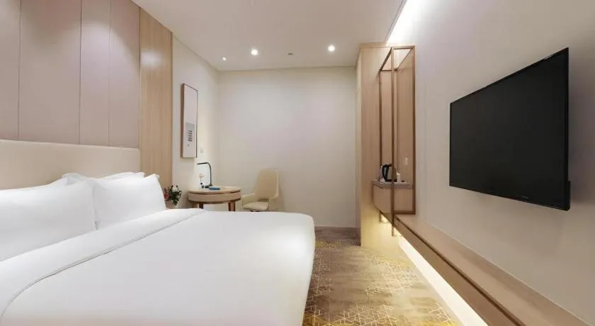Bed in GreenTree Eastern Hotel Shenzhen Nanshan District Qianhai Free Trade Zone Lilin Metro Station