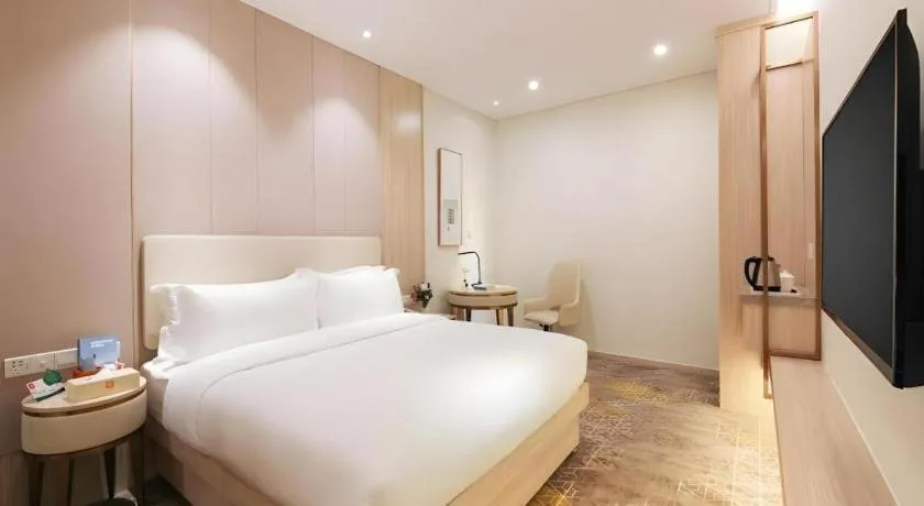 Bed in GreenTree Eastern Hotel Shenzhen Nanshan District Qianhai Free Trade Zone Lilin Metro Station