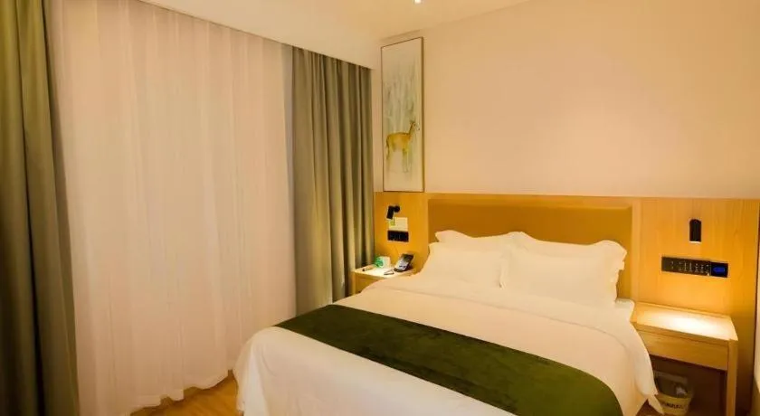 Bed in GreenTree Inn Express Henan Xinyang Huaibin County