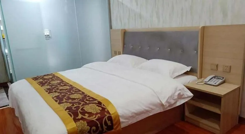 Bed in Super 8 Hotel Dingzhou Chongwen Street