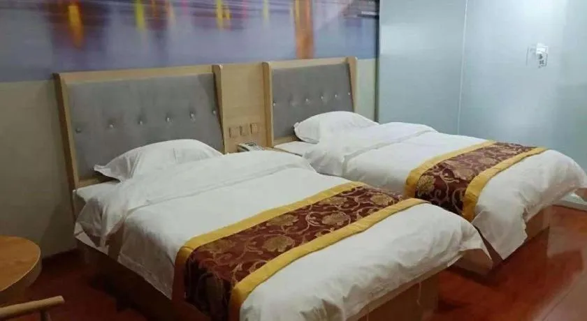 Bed in Super 8 Hotel Dingzhou Chongwen Street