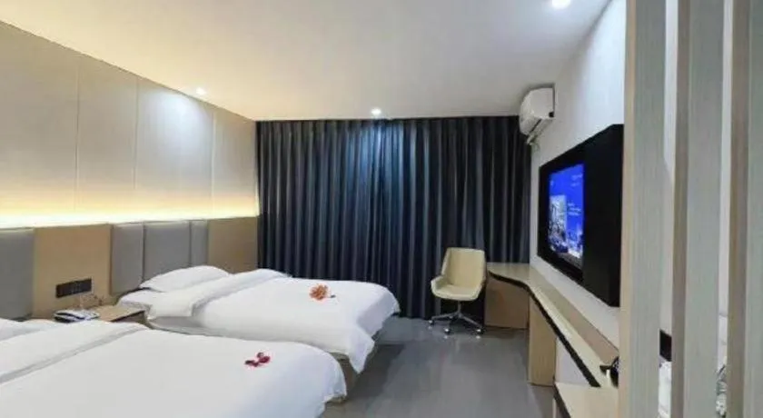 Bed in Super 8 Hotel Dingzhou Chongwen Street