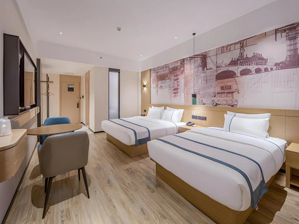 Bed in City Comfort Inn Wuzhou Xijiang Thrid Bridge