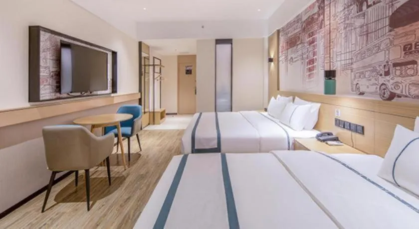 Bed in City Comfort Inn Wuzhou Xijiang Thrid Bridge