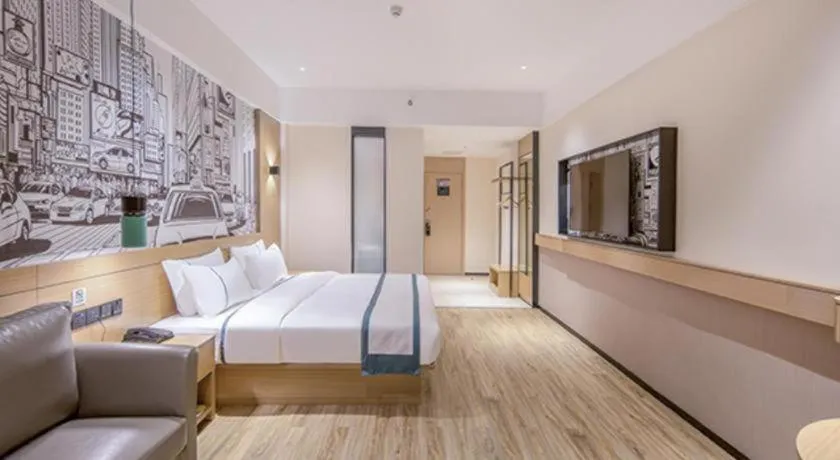 Bed in City Comfort Inn Wuzhou Xijiang Thrid Bridge