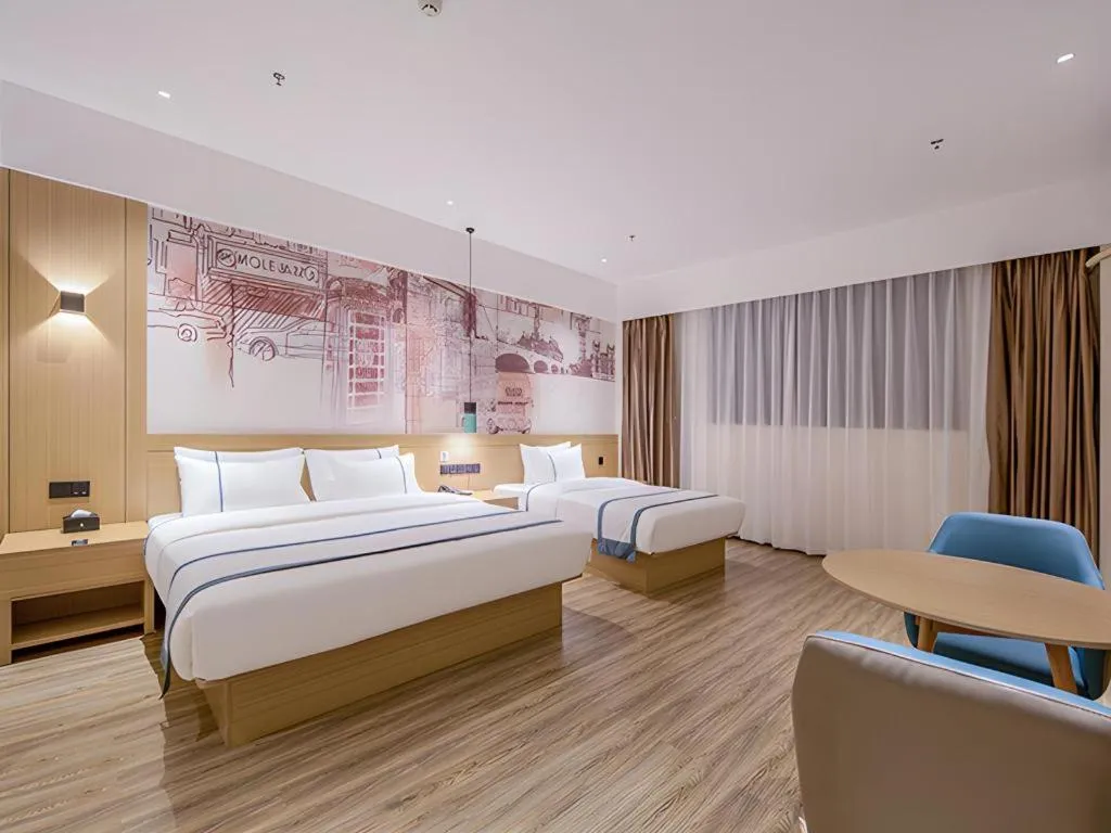 Bed in City Comfort Inn Wuzhou Xijiang Thrid Bridge