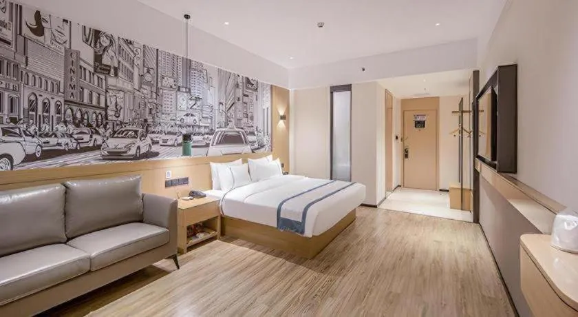 Bed in City Comfort Inn Wuzhou Xijiang Thrid Bridge