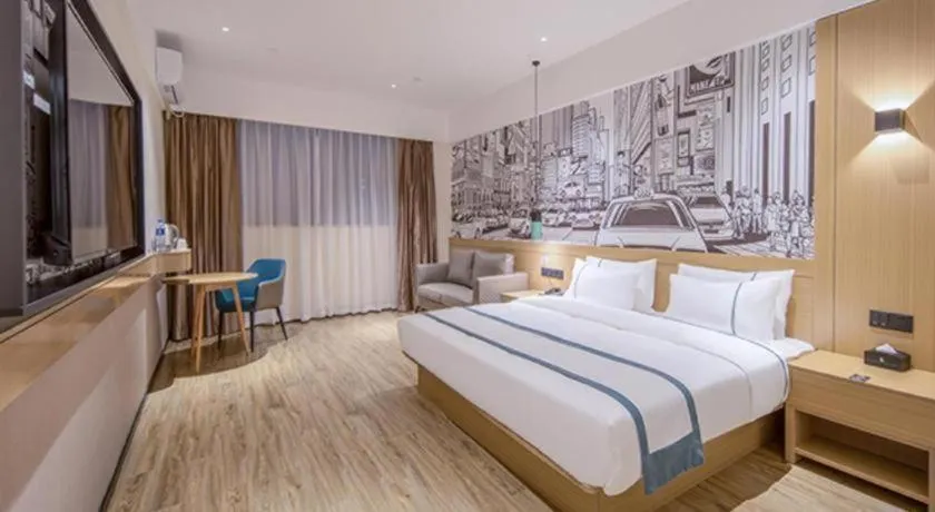 Bed in City Comfort Inn Wuzhou Xijiang Thrid Bridge