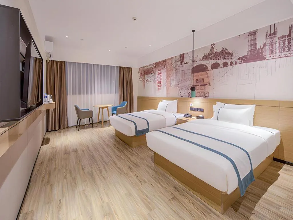 Bed in City Comfort Inn Wuzhou Xijiang Thrid Bridge