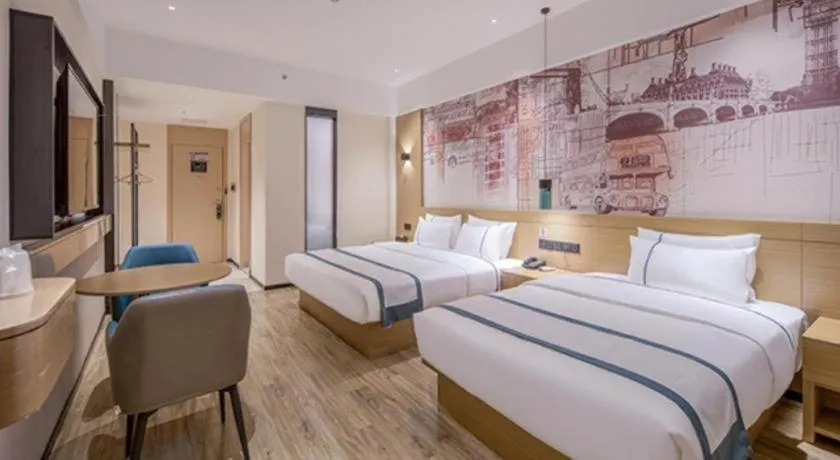 Bed in City Comfort Inn Wuzhou Xijiang Thrid Bridge