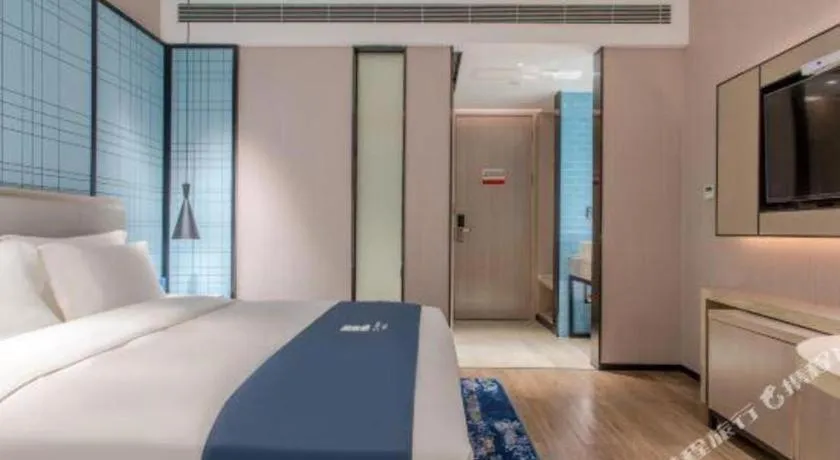 Bed in Echarm Hotel Fangchenggang Qisha