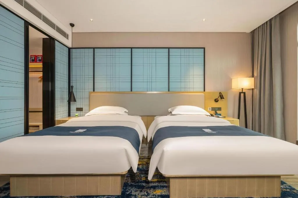 Bed in Echarm Hotel Fangchenggang Qisha