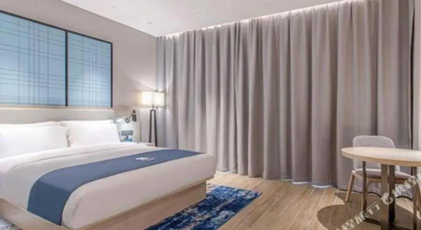 Bed in Echarm Hotel Fangchenggang Qisha