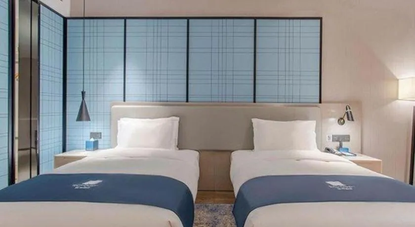 Bed in Echarm Hotel Fangchenggang Qisha