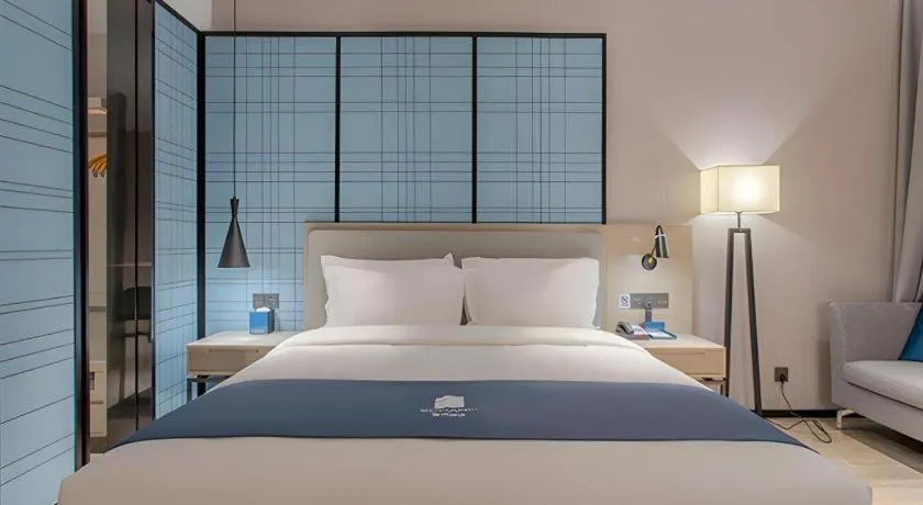 Bed in Echarm Hotel Fangchenggang Qisha