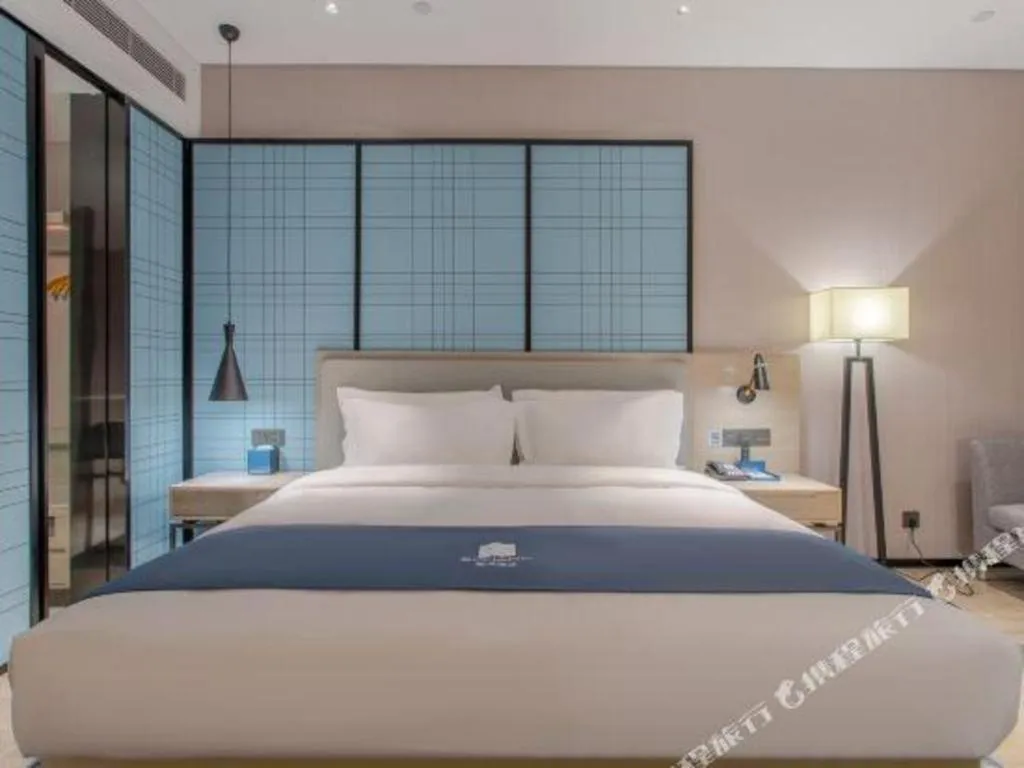 Bed in Echarm Hotel Fangchenggang Qisha