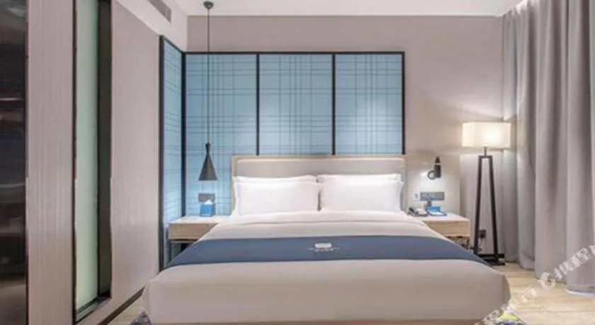 Bed in Echarm Hotel Fangchenggang Qisha