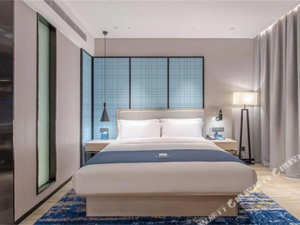 Bed in Echarm Hotel Fangchenggang Qisha