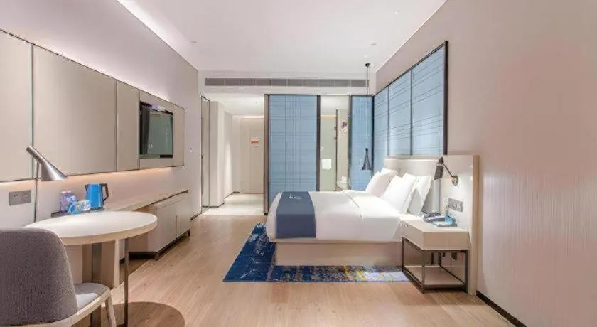 Bed in Echarm Hotel Fangchenggang Qisha